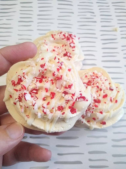 Vanilla Meringue Cookies Drizzled in White Chocolate and Crushed Candy Cane Sprinkles